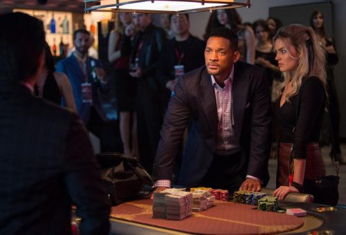 In this image released by Warner Bros. Pictures, Will Smith and Margot Robbie, right, appear in a scene from "Focus." (AP Photo/Warner Bros. Pictures, Frank Masi)