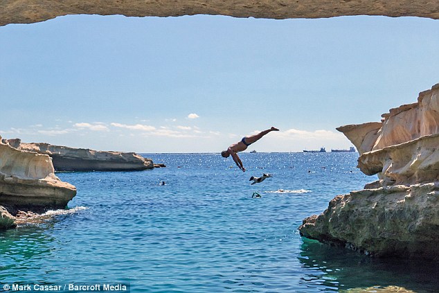 Mr Abelo taught Titti to dive when she was just four-months-old and at first learned to jump from small cliffs 