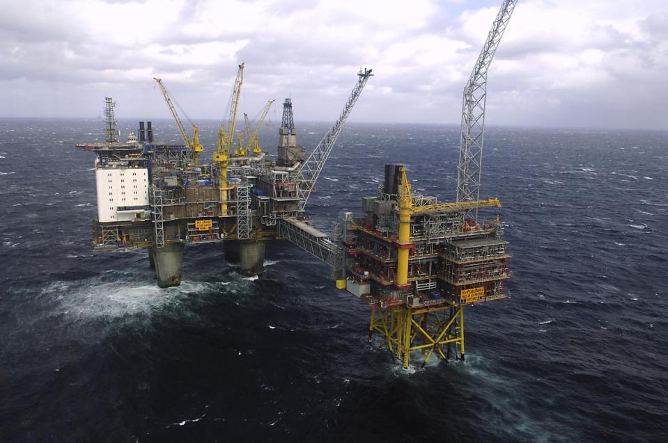 FILE - This April 19, 2007 aerial file photo shows the Oseberg oil platform in the Norwegian sea. After a decade of an oil and gas boom, plunging...
