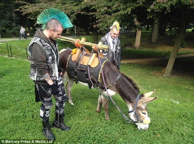 Mane attraction: Trekking with a donkey drew lots of attention, including from these two punks