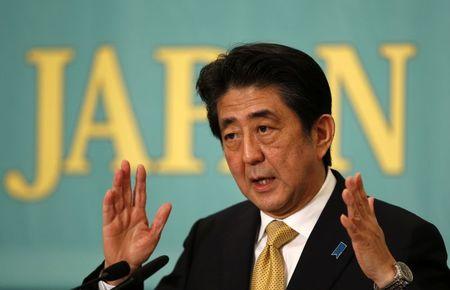 Japan&#39;s PMr and leader of the ruling LDP Abe speaks during a debate session with seven other party leaders ahead of the December 14 lower house...