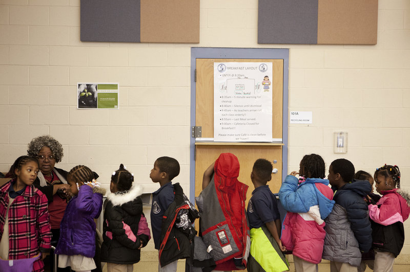 Kids line up to leave the lunchroom at Walker-Jones.