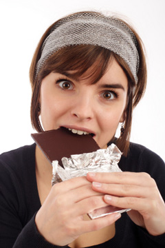 Woman Eating Chocolate