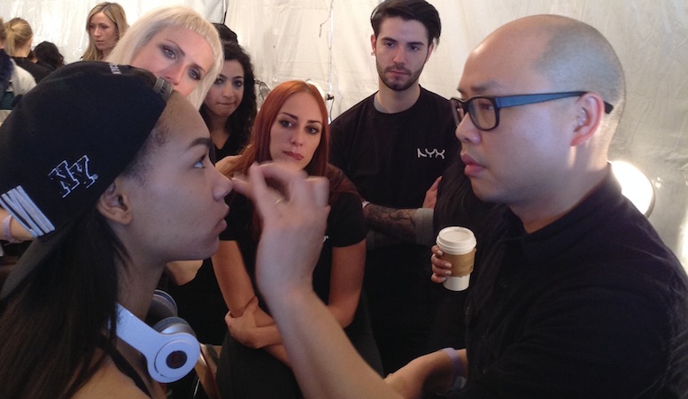 Makeup artist Daniel Martin working his magic backstage at New York Fashion Week in September 2013.