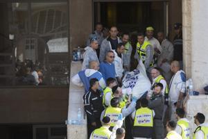 Israeli rescue workers carry a body at the scene of&nbsp;&hellip;