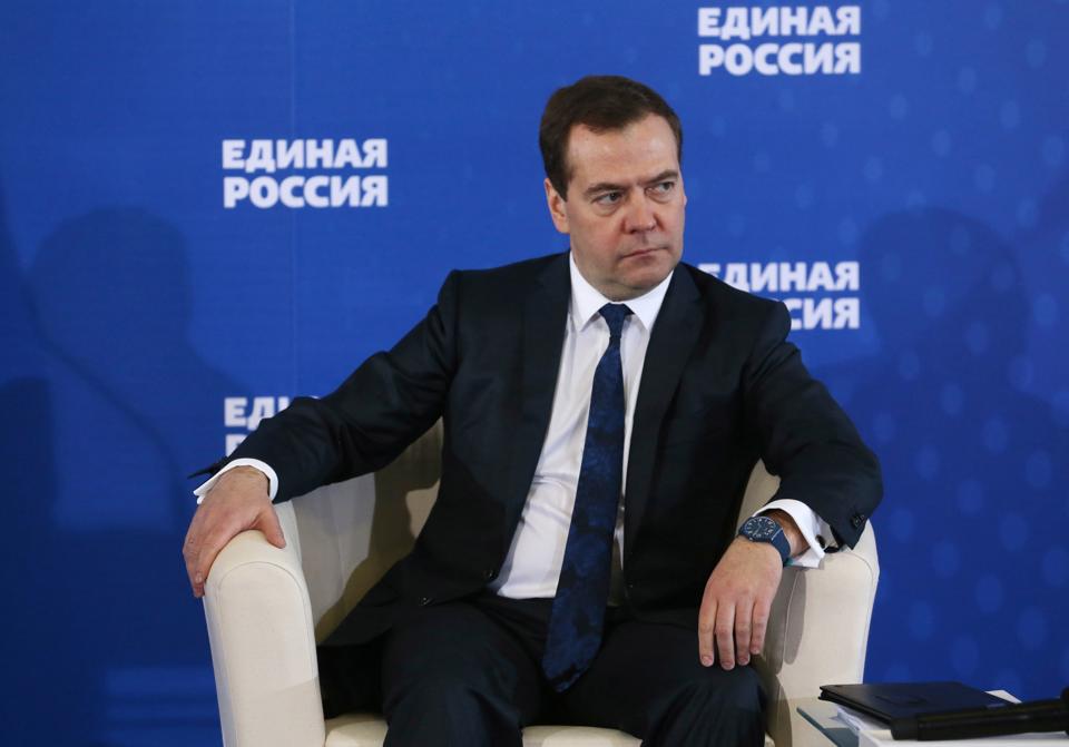 Russian Prime Minister Dmitry Medvedev  listens during a meeting with senior ruling United Russia Party officials in Moscow, Russia on Tuesday, Dec...