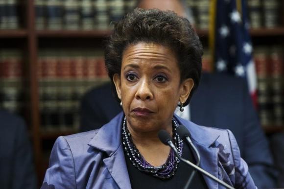 United States Attorney Loretta E. Lynch speaks during an announcement of the arrest of Abraxas J. (''A.J.'') Discala, CEO of OmniView Capital, and six co-conspirators for fraudulent market manipulation at the U.S. Attorney's office in Brooklyn, New York July 17, 2014. REUTERS/Lucas Jackson