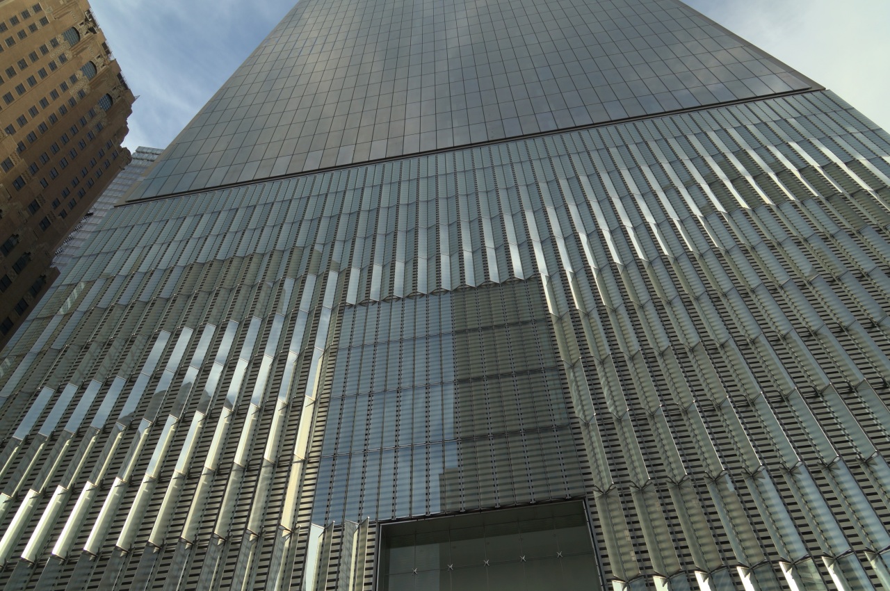 Angled glass fins protrude from stainless steel panels on the 185-foot tall concrete base of One World Trade Center. This base houses mechanical equipment and is designed to protect the building against ground-level explosions. (Lee Powell/TWP)