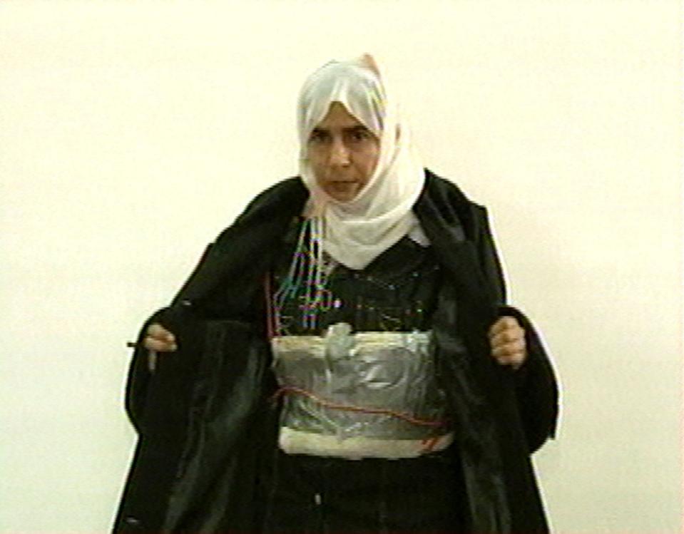 FILE  - This Nov. 13, 2005 file photo  made from television shows Iraqi Sajida al-Rishawi opens her jacket and shows an explosive belt as she...