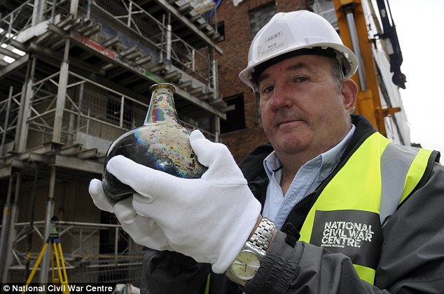 Kevin Winter, collections assistant at the National Civil War Centre is pictured holding the bottle on the Newark site. Newark and Sherwood District Council is working with Woodhead Heritage to turn the Old Magnus Buildings into a museum and visitor centre. It is hoped the bottle will go on display when the centre opens