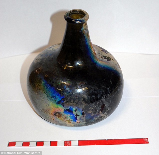 The green ‘witch bottle’ (pictured) is 6-inches tall (15cm) and experts have dated the bottle to around 1680. It is believed to have have been used during the 1700s to ward off evil spirits. Suspicious people believed that by placing items that linked a homeowner to the property, it would successfully stop evil forces entering the home