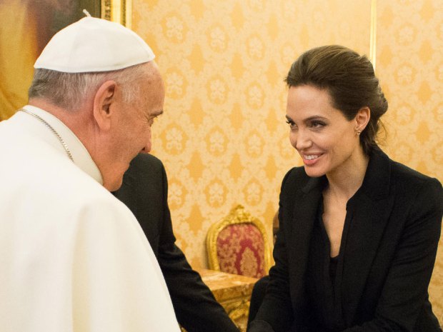 Pope Francis greets Angelina Jolie at the Vatican, and will reportedly attend a screening of her film Unbroken.