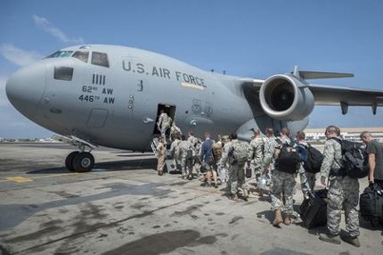 U.S. military personnel last month on their way to Liberia, an Ebola hotbed. (U.S. Air National Guard/Maj. Dale Greer/ via Reuters)