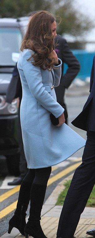 Wearing a light blue Matthew Williamson coat and heeled black boots the Duchess looked very chic