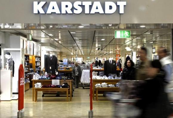 People pass an entrance of a Karstadt department store in Hamburg-Billstedt October 24, 2014. REUTERS/Fabian Bimmer