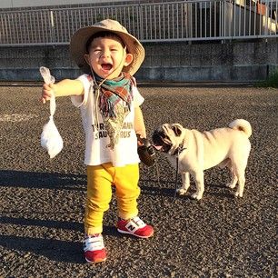 The little guy is even a good sport about picking up after Mr. Kimchi. | This Little Boy And His Pug Are The Cutest BFFs On The Planet