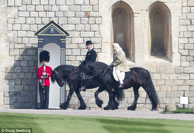 No helmet: The Queen, pictured here on Friday, never wears a riding helmet preferring instead to ride in a silk headscarf