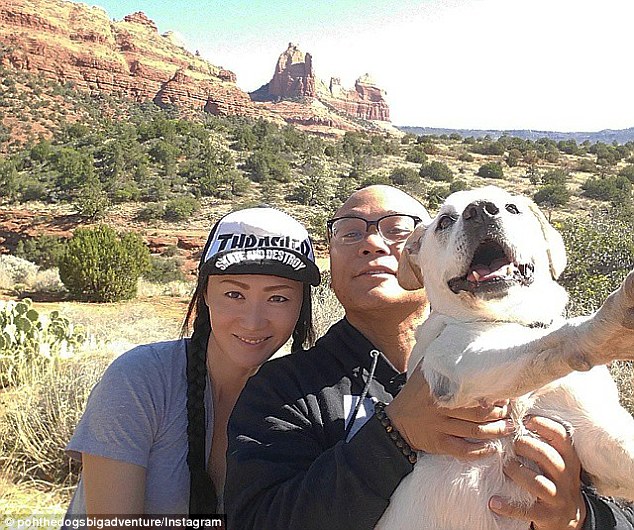 Bucket list adventure: Thomas Neil Rodriguez took his terminally ill dog, Poh, on a bucket list adventure from coast to coast. Above, Mr Rodriguez, his fiancée Goumada and Poh are seen in Sedona, Arizona, in March