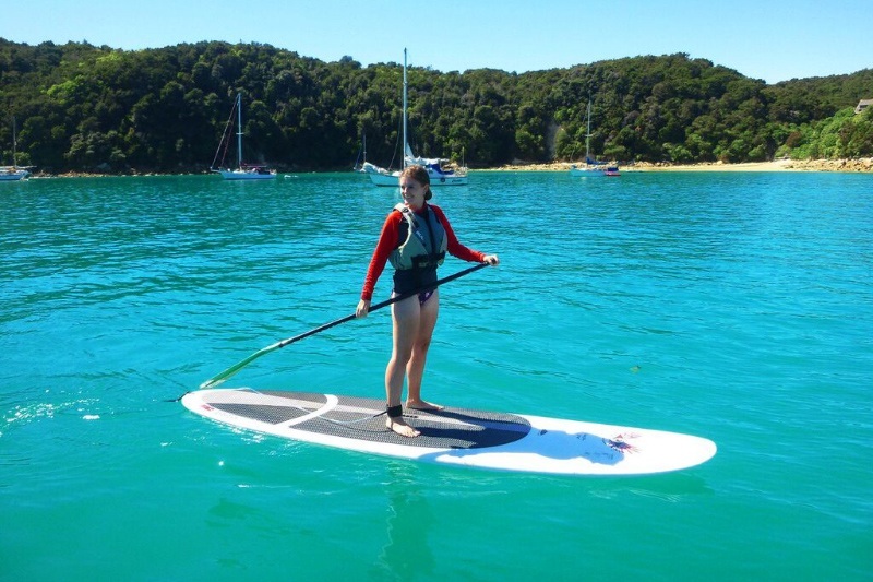 Lauren paddleboarding in Abel Tasman, New Zealand