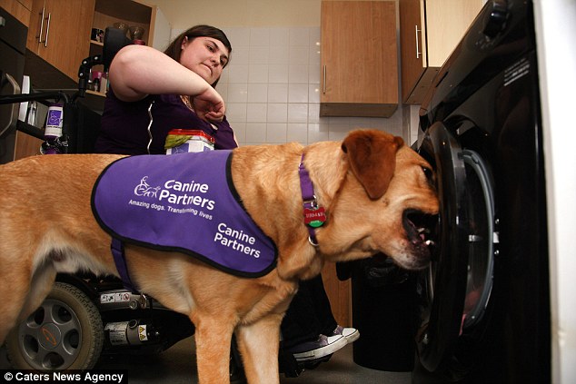 Among his daily tasks are loading the washing machine, which Griffin does with ease at their home