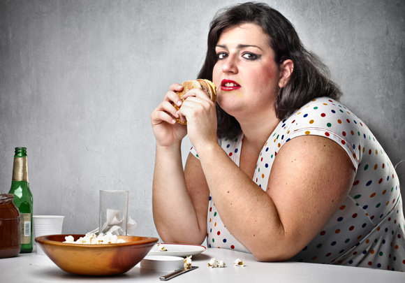 Obese Woman Eating Junk Food