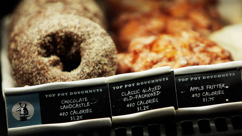 How many calories in that doughnut? A Starbucks coffee shop in New York City displays calorie information next to menu items. New FDA rules will require all chain restaurants and similar eating establishments to post calorie labels.