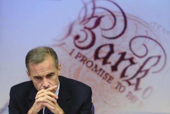 Bank of England Governor Mark Carney listens to a question during the bank's quarterly inflation report news conference at the Bank of England in London November 12, 2014. REUTERS/Stefan Rousseau/pool