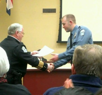 Ferguson police Officer Darren Wilson accepts a commendation from Chief Tom Jackson in February 2014. (Facebook)