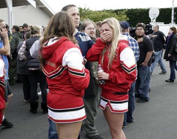 Students and family members reunite at Shoultes Gospel Hall church after an active shooter situation at Marysville-Pilchuck High School in Marysville, Washington October 24, 2014. REUTERS/Jason Redmond
