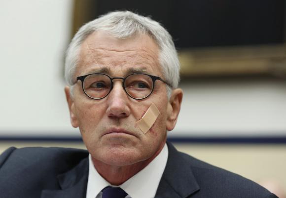 Secretary of Defense Chuck Hagel listens during his testimony at the House Armed Services Committee on Capitol Hill, November 13, 2014. REUTERS/Larry Downing