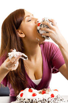 Woman Stuffing Herself With Cake