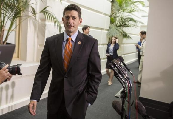 Budget Committee Chairman Paul Ryan (R-WI) walks from a Republican caucus meeting at the Capitol in Washington August 1, 2014.   REUTERS/Joshua Roberts