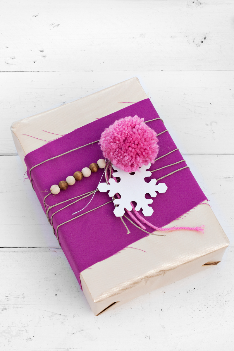 Use leftover beads and twine to add whimsy to your gift wrapping.