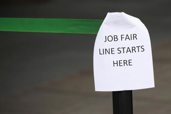 A sign marks the entrance to a job fair in New York October 24, 2011.REUTERS/Shannon Stapleton